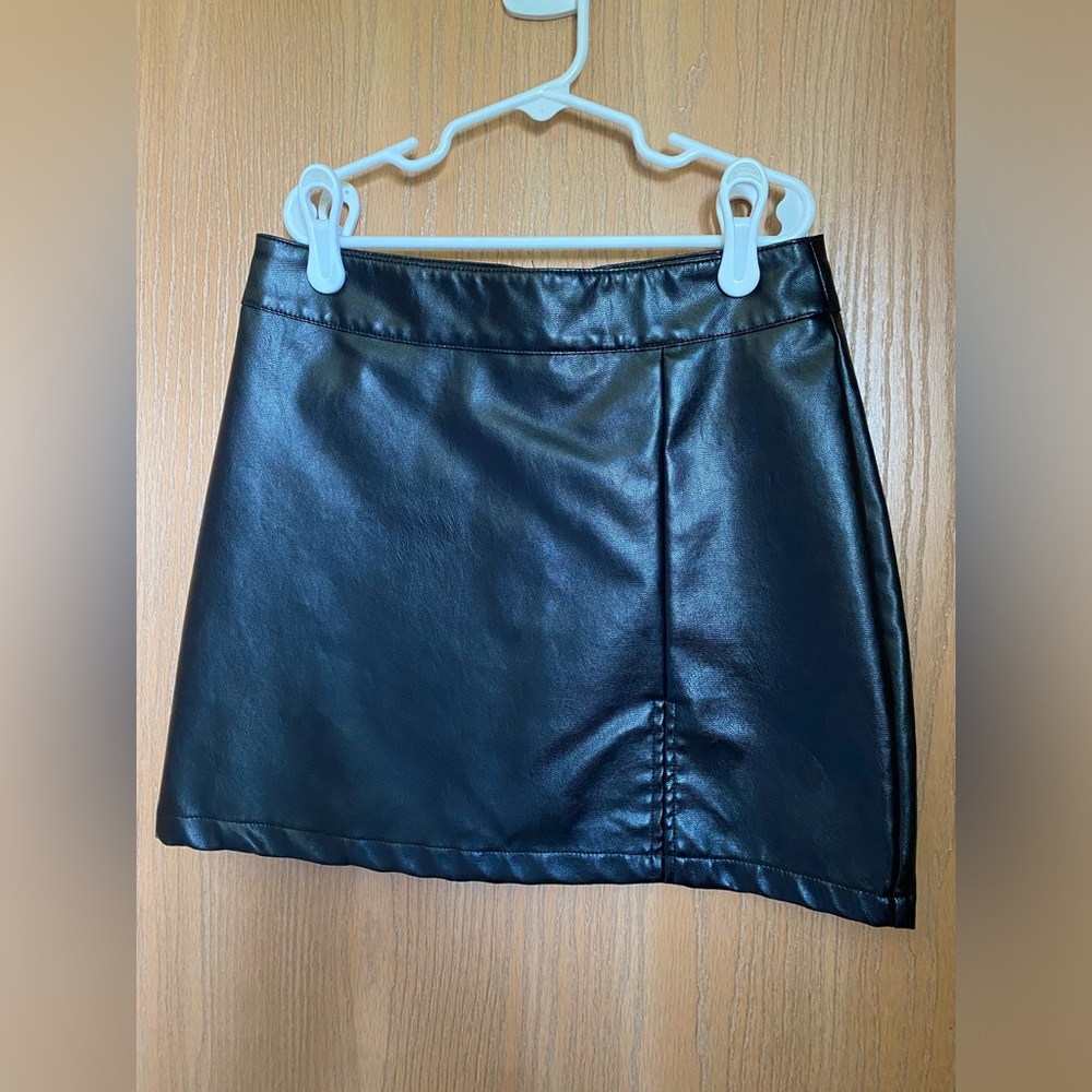 Mini skirt. Small slit on left side. True to size.